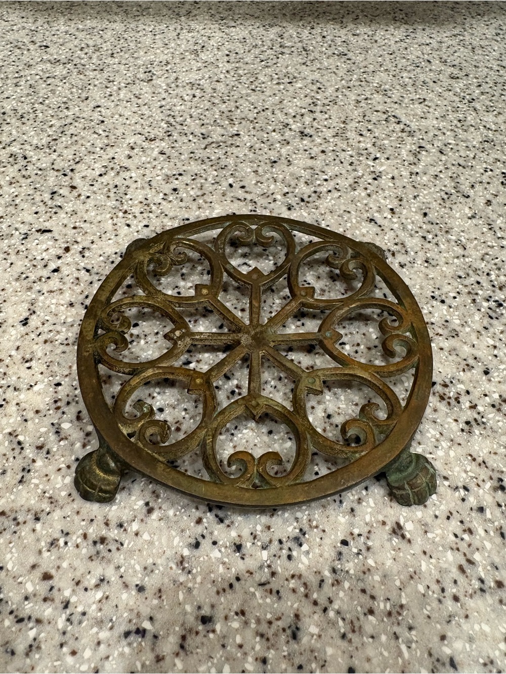 Vintage brass footed trivet, candle holder